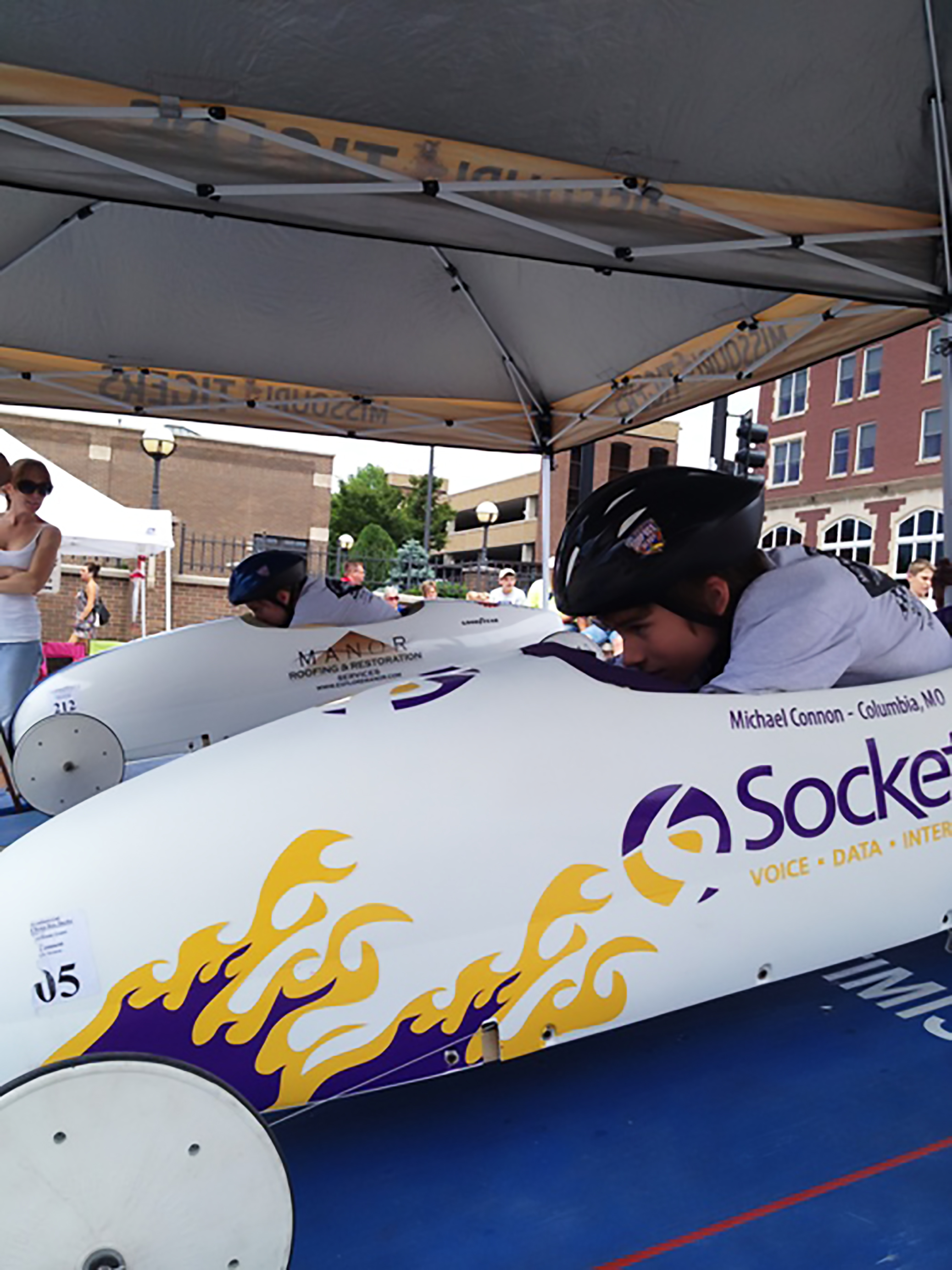 Michael Connon crouches into the pit of the first Socket Derby car. 