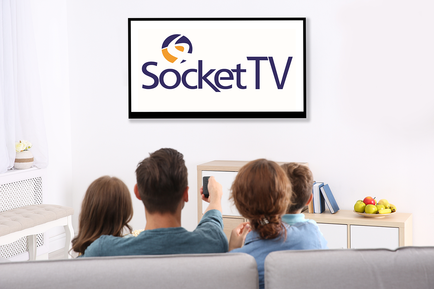 family watching socket tv on their television