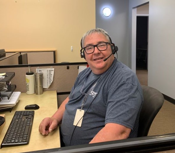Photo of Steven Sullivan in the Socket call center wearing headset.