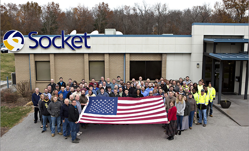 Socket employees hold an American flag