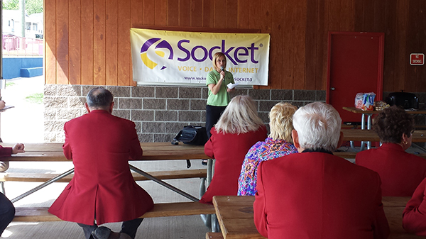 A representative from socket speaks to a group of people