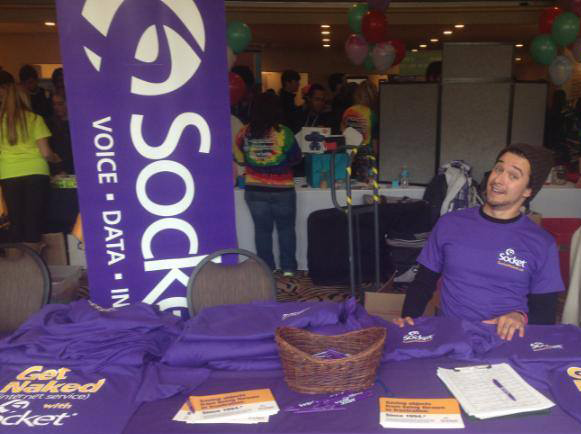 A man sits at a socket booth at the Housing Fair