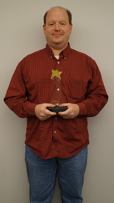 Scott Stratman holds Socketeer of the Year trophy